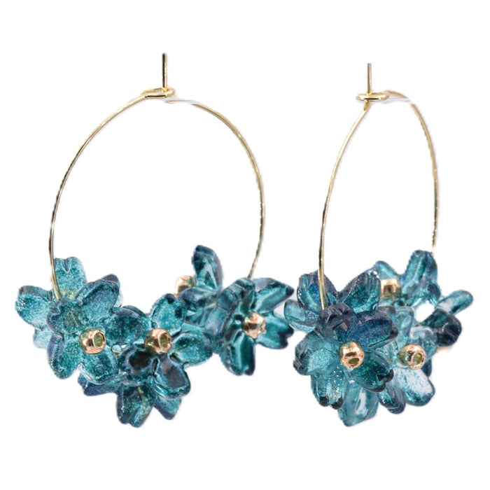 Blue floral earrings on golden steel hoops (1 pair)