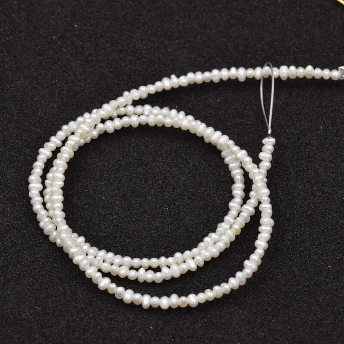 White Potato Freshwater Pearl 1-1.5x2-2.5mm (1strand - 39cm)