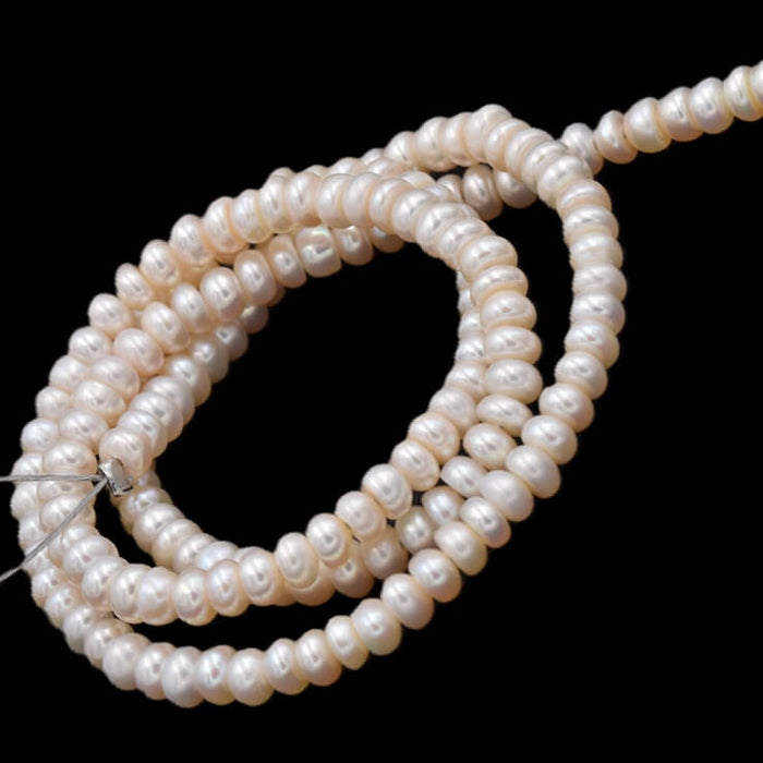 Freshwater pearl round potatoe champagne - 5x4mm - Hole: 0.6mm (1 Strand)