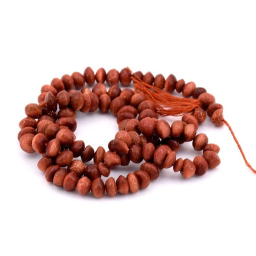 Synthetic goldstone button beads 4-5x5-6mm - Hole: 0.5mm (1 strand - 34cm)