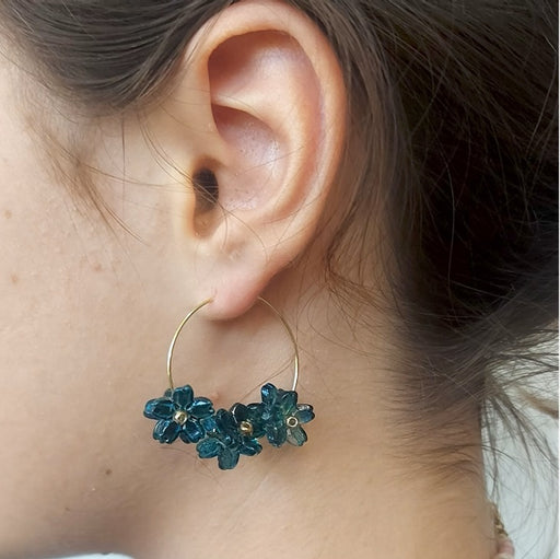 Blue floral earrings on golden steel hoops (1 pair)