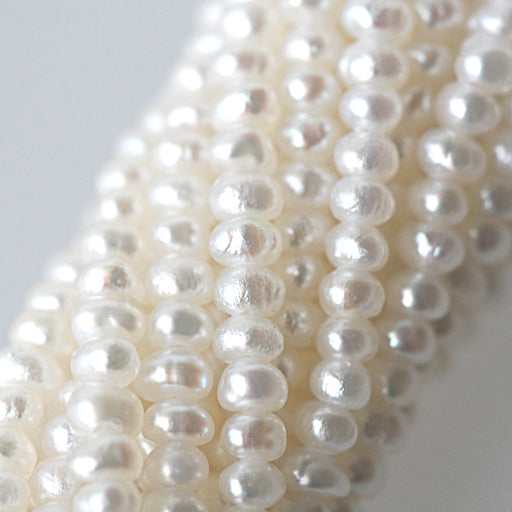 Freshwater pearls button white 2mm (1)